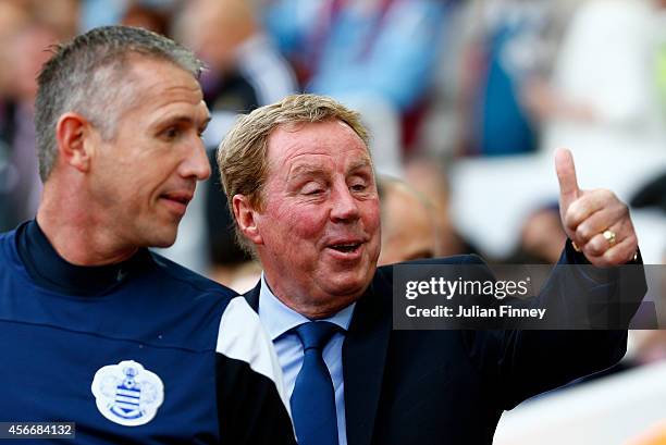 Harry Redknapp the QPR manager gives a thumbs up as he speaks with his goalkeeping coach Kevin Hitchcock during the Barclays Premier League match...