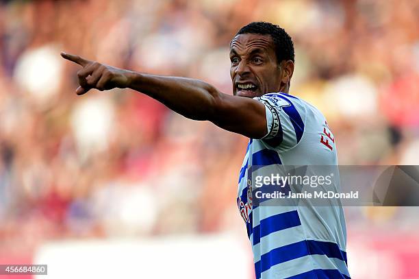 Rio Ferdinand of QPR signals during the Barclays Premier League match between West Ham United and Queens Park Rangers at Boleyn Ground on October 5,...