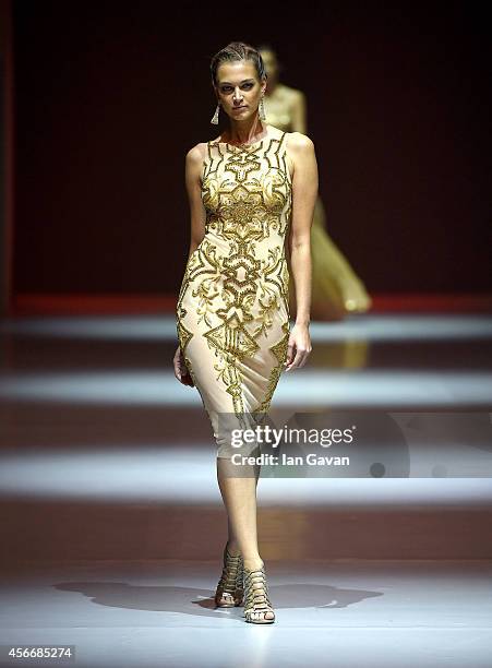 Model walks the runway at the Dany Tabet show during Fashion Forward at Madinat Jumeirah on October 5, 2014 in Dubai, United Arab Emirates.