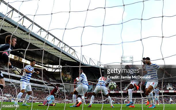 Nedum Onuoha of QPR scores an own goal during the Barclays Premier League match between West Ham United and Queens Park Rangers at Boleyn Ground on...