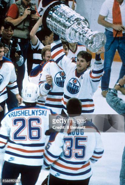 Wayne Gretzky of the Edmonton Oilers celebrates with the Stanley Cup after the Oilers defeated the Philadelphia Flyers in Game 7 of the 1987 Stanley...