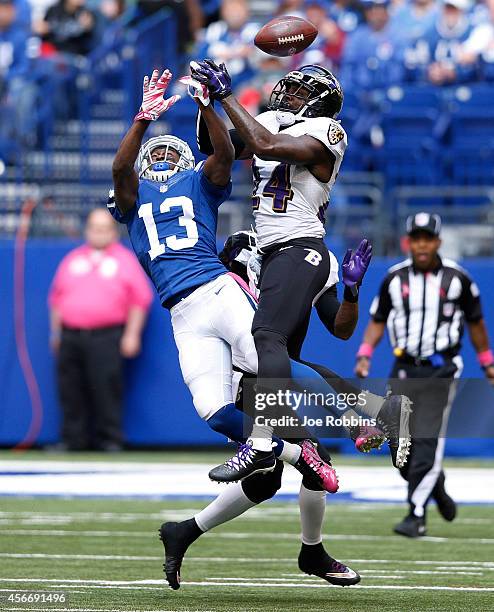 Darian Stewart of the Baltimore Ravens breaks up a pass intended for T.Y. Hilton of the Indianapolis Colts in the first half of the game at Lucas Oil...