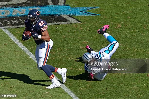 Melvin White of the Carolina Panthers misses a tackle against Matt Forte of the Chicago Bears during their game at Bank of America Stadium on October...