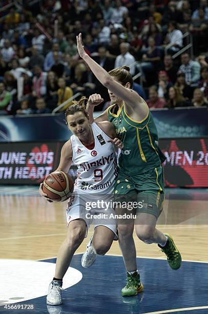 Esmeral Tuncluer of Turkey drives towards the hoop during the 2014 FIBA Women's World Championship third place play-off basketball match between...