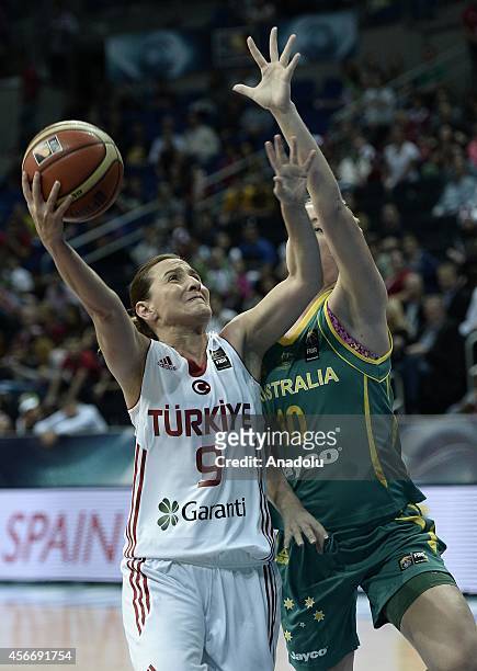 Esmeral Tuncluer of Turkey challenges Rachel Jarry of Australia during the 2014 FIBA Women's World Championship third place play-off basketball match...