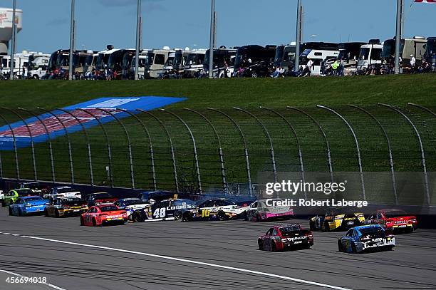 Jimmie Johnson, driver of the Lowe's Chevrolet, and Greg Biffle, driver of the 3M Filtrete Ford, lose control of their cars during the NASCAR Sprint...