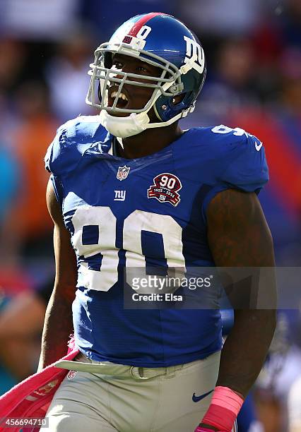 Defensive end Jason Pierre-Paul of the New York Giants reacts after a play in the fourth quarter against the Atlanta Falcons during their game at...