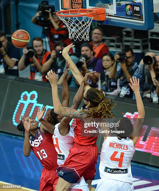 S Seimone Augustus is in action with Sancho Lyttle of Spain during the 2014 FIBA Women's World Championships final basketball match between Spain and...