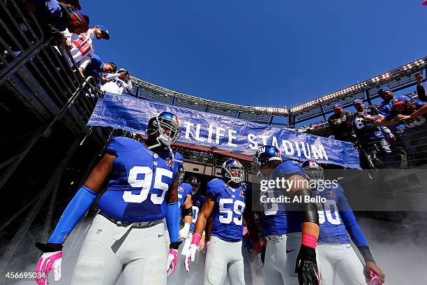 Defensive tackle Johnathan Hankins, outside linebacker Devon Kennard, defensive tackle Markus Kuhn and defensive end Jason Pierre-Paul of the New...