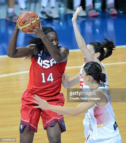 Tina Charles of USA is in action with Spains Leticia Romero during the 2014 FIBA Women's World Championships final basketball match between Spain and...