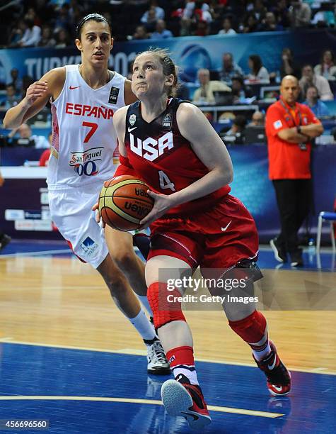 S Lindsay Whalen rides the ball past Silvia Dominguez of Spain during the 2014 FIBA Women's World Championships final basketball match between Spain...