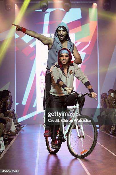 Model walks the runway at the HRX by Hrithik Roshan show during day 3 of Myntra Fashion Weekend 2014 at The Palladium Hotel on October 5, 2014 in...