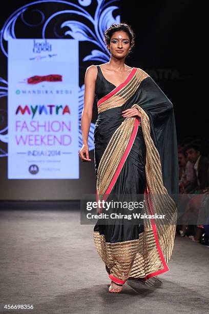 Model showcases designs by Mandira Bedi during day 3 of Myntra Fashion Weekend 2014 at The Palladium Hotel on October 5, 2014 in Mumbai, India