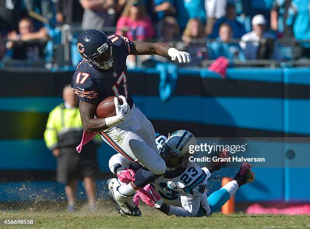 Melvin White of the Carolina Panthers tackles Alshon Jeffery of the Chicago Bears during their game at Bank of America Stadium on October 5, 2014 in...