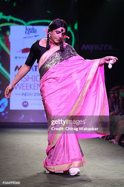 Sunil Grover showcases designs by Mandira Bedi during day 3 of Myntra Fashion Weekend 2014 at The Palladium Hotel on October 5, 2014 in Mumbai, India