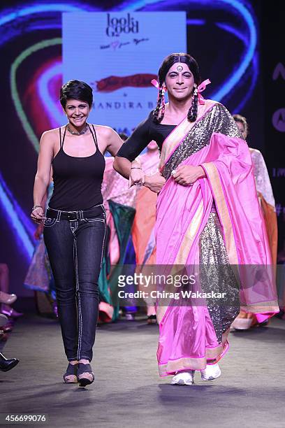 Sunil Grover & Mandira Bedi walk the runway during day 3 of Myntra Fashion Weekend 2014 at The Palladium Hotel on October 5, 2014 in Mumbai, India