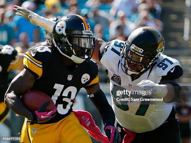 Roy Miller of the Jacksonville Jaguars attempts to tackle Dri Archer of the Pittsburgh Steelers during the game at EverBank Field on October 5, 2014...