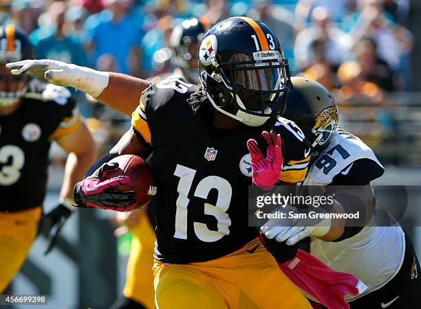 Roy Miller of the Jacksonville Jaguars attempts to tackle Dri Archer of the Pittsburgh Steelers during the game at EverBank Field on October 5, 2014...