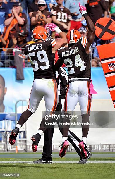 Tank Carder and Johnson Bademosi of the Cleveland Browns celebrate after a blocked punt against the Tennessee Titans at LP Field on October 5, 2014...