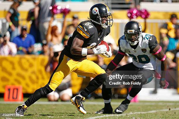 Antonio Brown of the Pittsburgh Steelers is defended by Craig Loston of the Jacksonville Jaguars during the second half of the game at EverBank Field...