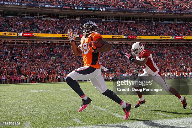 Wide receiver Demaryius Thomas of the Denver Broncos out sprints free safety Rashad Johnson of the Arizona Cardinals for an 86 yard touchdown in the...
