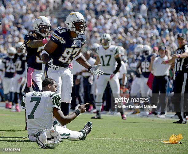 Geno Smith the New York Jets is tackled by Jarret Johnson of the San Diego Chargers during their NFL game at Qualcomm Stadium on October 5, 2014 in...