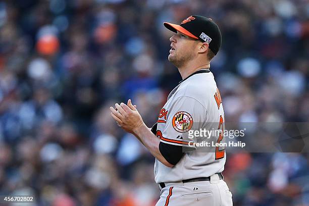 Bud Norris of the Baltimore Orioles looks at the scoreboard in the seventh inning against the Detroit Tigers during Game Three of the American League...