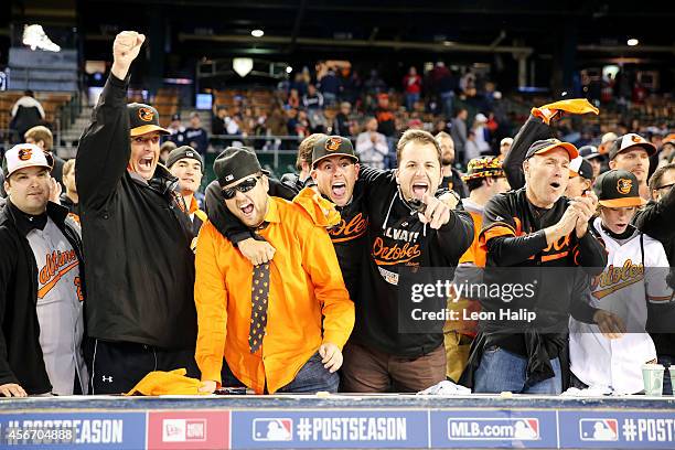 Baltimore Orioles fans celebrate their 2 to 1 win over the Detroit Tigers to sweep the series in Game Three of the American League Division Series at...