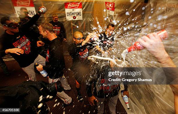 The Baltimore Orioles celebrate in the locker room after their 2 to 1 win over the Detroit Tigers to sweep the series in Game Three of the American...