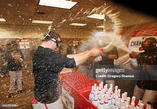 The Baltimore Orioles celebrate in the locker room after their 2 to 1 win over the Detroit Tigers to sweep the series in Game Three of the American...