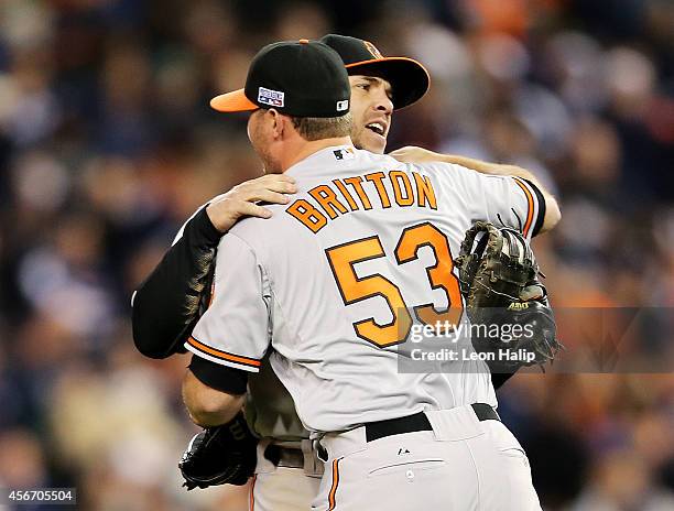 Zach Britton and Nick Hundley of the Baltimore Orioles celebrate their 2 to 1 win over the Detroit Tigers to sweep the series in Game Three of the...