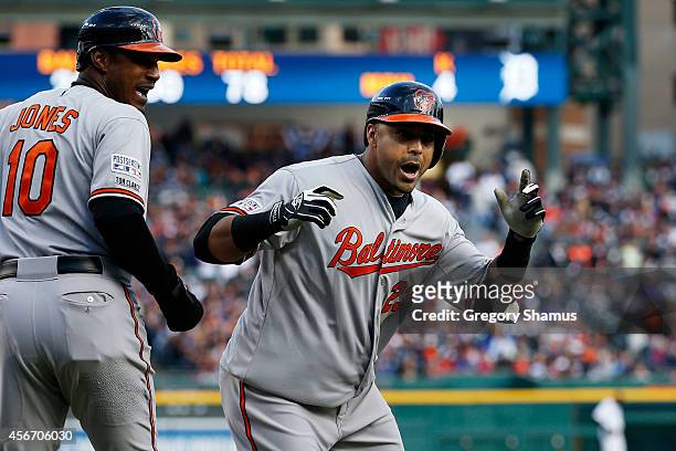 Nelson Cruz of the Baltimore Orioles celebrates with Adam Jones after hitting a two-run home run in the sixth inning against the Detroit Tigers...