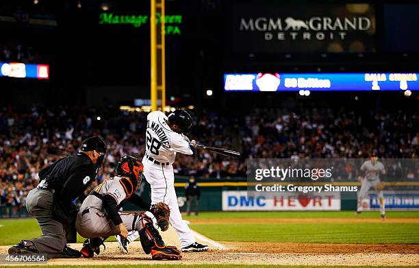 Martinez of the Detroit Tigers hits an RBI double scoring Victor Martinez of the Detroit Tigers in the ninth inning against the Baltimore Orioles...