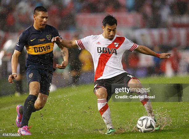 Gabriel Mercado of River Plate fights for the ball with Andres Chavez of Boca Juniors during a match between River Plate and Boca Juniors as part of...