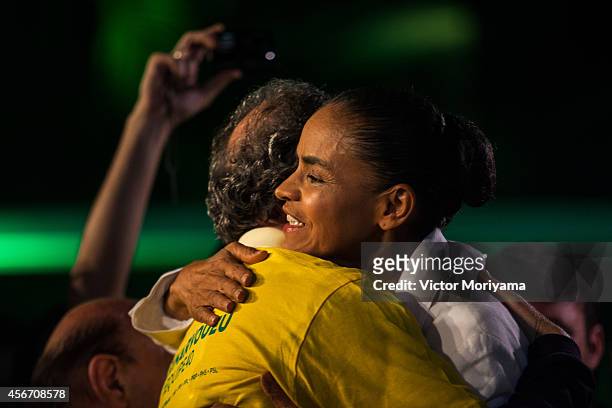 Brazilian candidate for President Marina Silva gives a hug during a press conference at the Brazilian Socialist Party on October 5, 2014 in Sao...