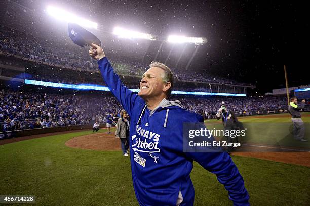 Manager Ned Yost the Kansas City Royals celebrates on the field after defeating the Los Angeles Angels 8-3 to sweep the series in Game Three of the...