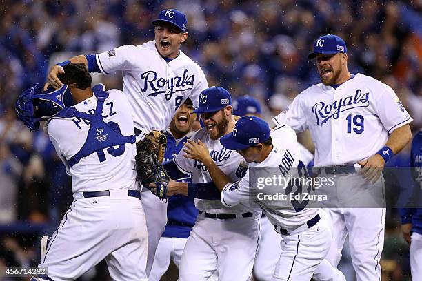 Greg Holland celebrates with Norichika Aoki of the Kansas City Royals after defeating the Los Angeles Angels 8-3 in Game Three of the American League...