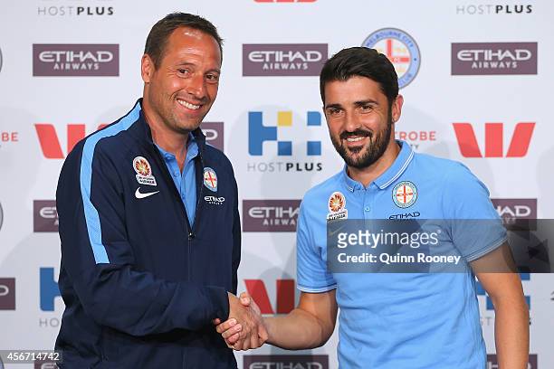 Melbourne City Head Coach John vant Schip shakes hands with David Villa during a Melbourne City Football Club Press Conference at AAMI Park on...