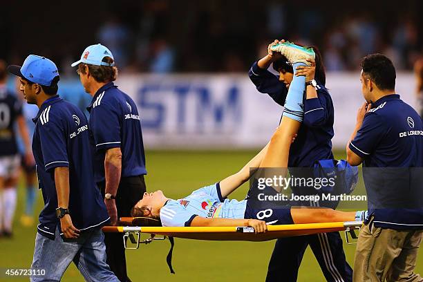 Amy Harrison of Sydney FC is carried off the pitch with muscle cramps during the round four W-League match between Sydney and Melbourne at Lambert...