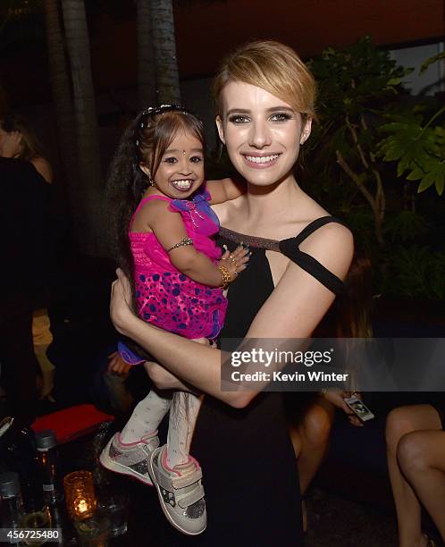 Actresses Jyoti Amge and Emma Roberts pose at the after party for the premiere screening of FX's "American Horror Story: Freak Show" at the Roosevelt...