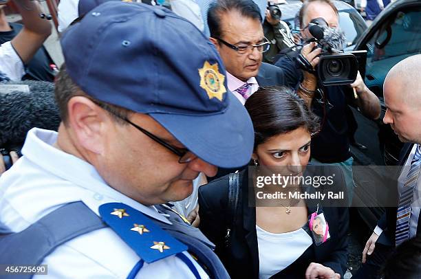 Anni Dewani's father Mr Vinod Hindocha and sister Ami Denborg arrive at the Western Cape High Court for the start of the trial of Shrien Dewani, on...