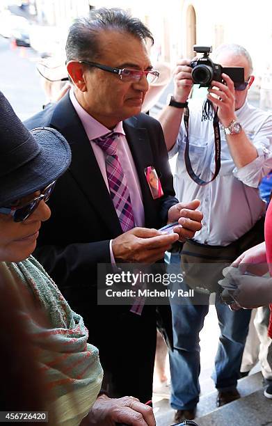 Anni Dewani's father Mr Vinod Hindocha arrives at the Western Cape High Court for the start of the trial of Shrien Dewani, on October 6, 2014 in Cape...