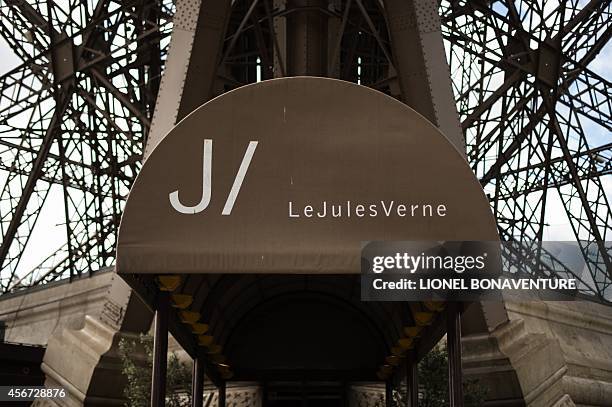 Photo taken on May 9, 2014 shows the entrance of Alain Ducasse's "Le Jules Verne" restaurant at the Eiffel Tower in Paris. AFP PHOTO LIONEL...