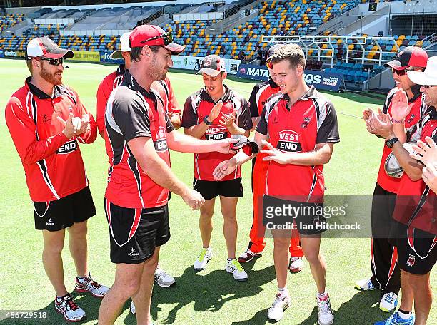 Nick Winter of the Redbacks is presented with his cap by Shaun Tait before his debut match during the Matador BBQs One Day Cup match between Victoria...