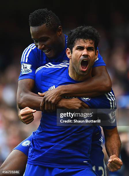Diego Costa of Chelsea celebrates scoring their second goal with John Obi Mikel of Chelsea during the Barclays Premier League match between Chelsea...