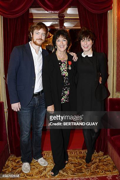 French actress Anny Duperey poses with her son Gael Giraudeau and his companion Anne Auffret after being awarded by the Legion d'Honneur at the...
