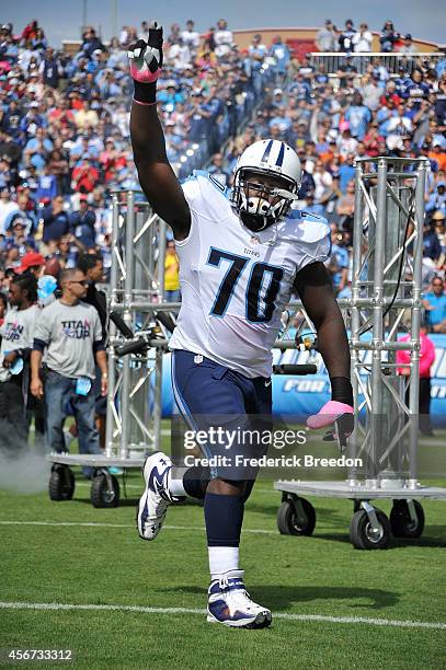 Chance Warmack of the Tennessee Titans runs onto the field prior to a game against the Cleveland Browns at LP Field on October 5, 2014 in Nashville,...