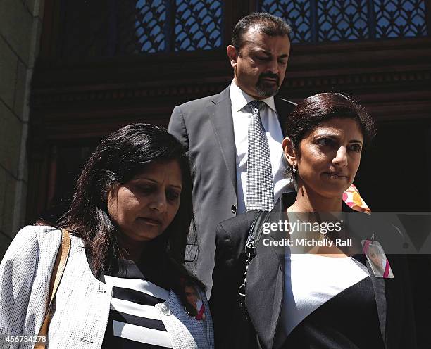 Anni Dewani's sister, Ami Denborg, flanked by Anni's parents Nilam and Vinod Hindocha, walks outside the Western Cape High Court during the start of...