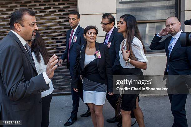 Anni Dewani's family leaves the Western Cape High Court for a lunch break during the trial of Shrien Dewani, on October 6, 2014 in Cape Town, South...