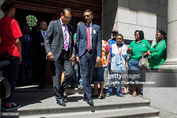 Anni Dewani's father Mr Vinod Hindocha and son Anish Hindocha leave the the Western Cape High Court for a lunch break during the trial of Shrien...